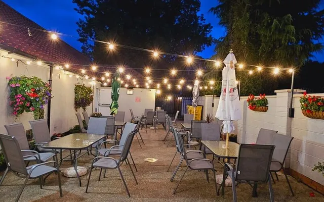 The beer garden at dusk with festoon lighting